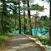 The wooded, 2.6 km (1.6 mile), ADA accessible trail around beautiful, turquoise Lake Annette.