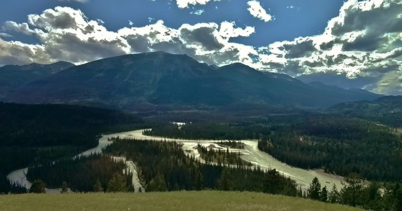 Whistlers Summit looms over the Athabasca River far below, when looking southwest from the western viewpoint along the Old Fort Point Loop trail.