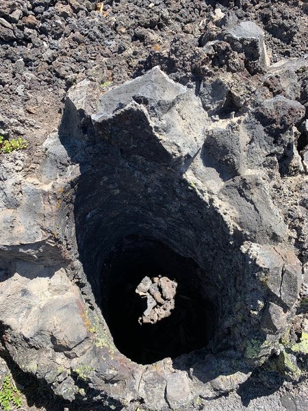 A vertical cast made from lava cooling around a tree, which then burned and rotted away.