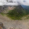 The valley north of Logan Pass from Highline Trail with Going-to-the-Sun Road following the contour line of the Garden Wall Divide.