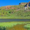 Meadows and red rocks surrounding highest of Clark Lakes