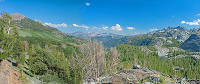 Looking down San Joaquin River canyon with San Joaquin Mountain on the left and the Ritter Range on the right. Mammoth Crest is in the center with the Silver Divide behind it. Badger Lake is on the right.