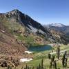 On top of Deer Creek pass, overlooking the first of the four lakes and Siligo peak. The trail continues up to the left of the photo.