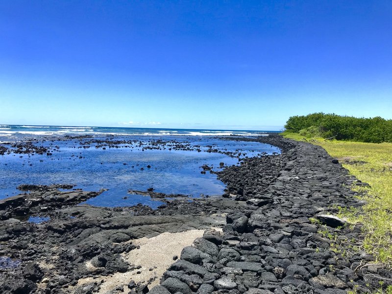 A lava stone pathway follows the beautiful cost. Keep your eye out for turtles!