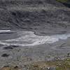 View down into the Glacier Bowl in the summer as snow melts and feeds a creek that runs down the mountain.