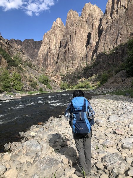 Single campsite is down and to the right at the bottom of the draw. Hiking along the stone beach in the morning.