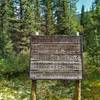 Old historic sign marking Howse Pass National Historic Site.