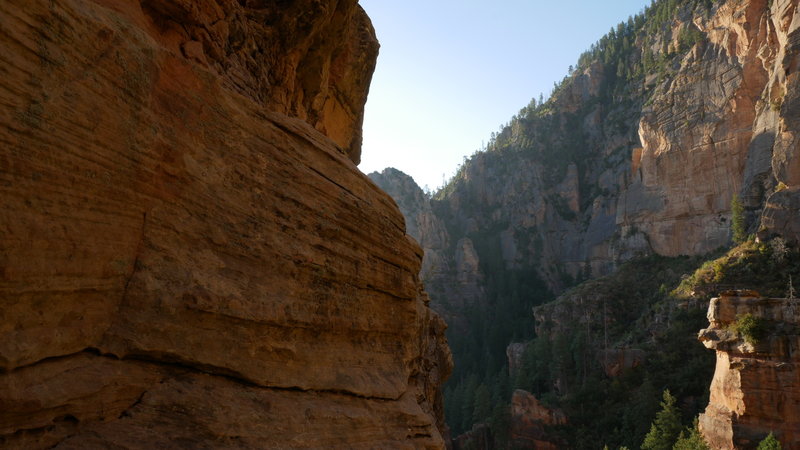 Standing behind the knife edge of the pinnacle looking out one side of it.