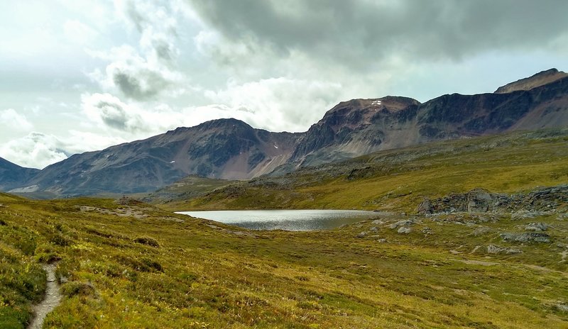 The Endless Chain Ridge and the small lake at Maligne Pass, are seen from the north end of the pass.