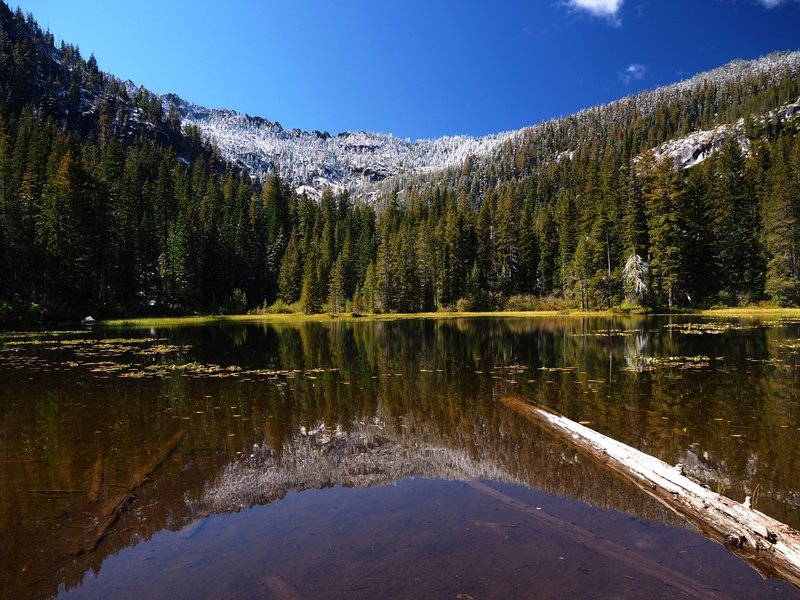 Sugar Lake with a dusting of snow on the ridge above.