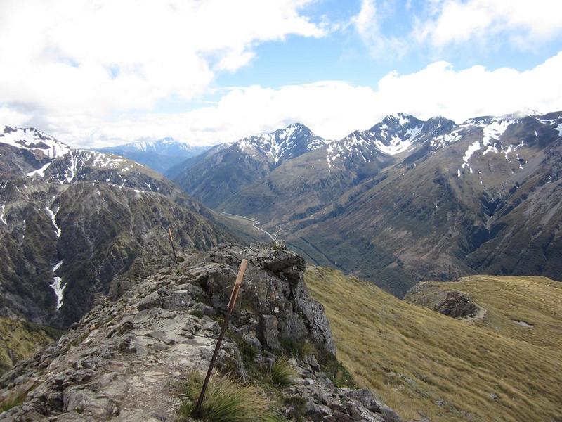 The trail slices along the ridge