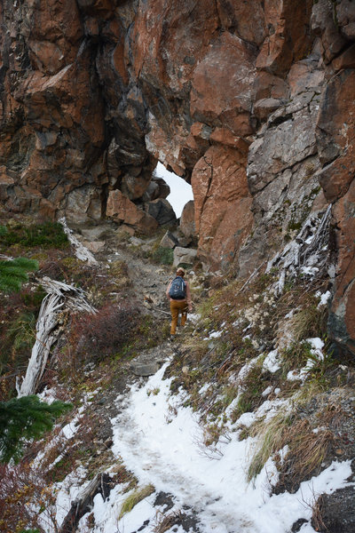 Approaching the rock archway the trail passes through