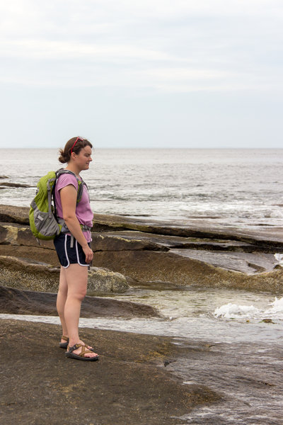 Anne on the edge of the rocks.