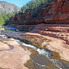 "Slide Rock State Park, Oak Creek Canyon, AZ 9-15" by Don Graham (https://www.flickr.com/photos/23155134@N06/) licensed under CC-BY-SA 2/0 (https://creativecommons.org/licenses/by-sa/2.0/).