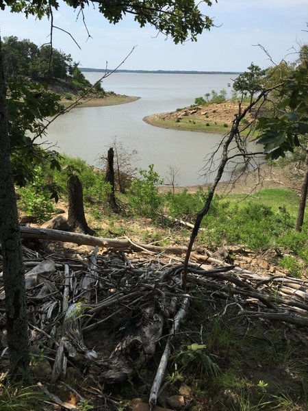 Trail is covered in limbs and trees that floated in this summer.  It's a good 35 feet down to the water here!