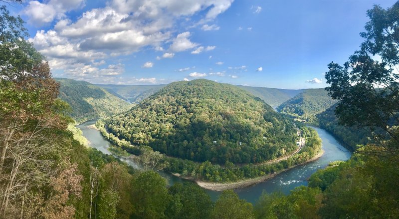 View across the river. To the right you can see buildings from the town of Thurmond. Looking downstream to the left the course follows along the left side of the river towards Cunard.