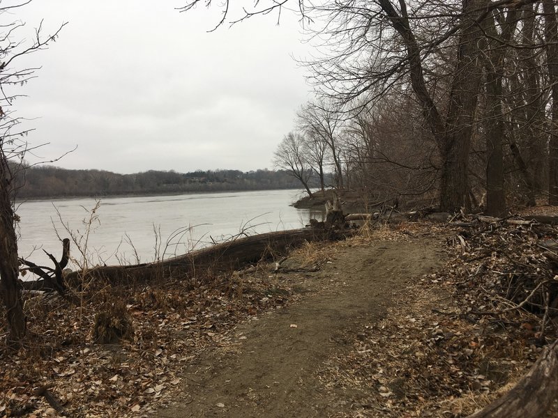 The trail runs right along the river, and mostly consists of sand.