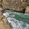 Waves crash into Partington Cove, a hidden inlet accessible via tunnel. A sign that warns against swimming or wading isn't a joke.