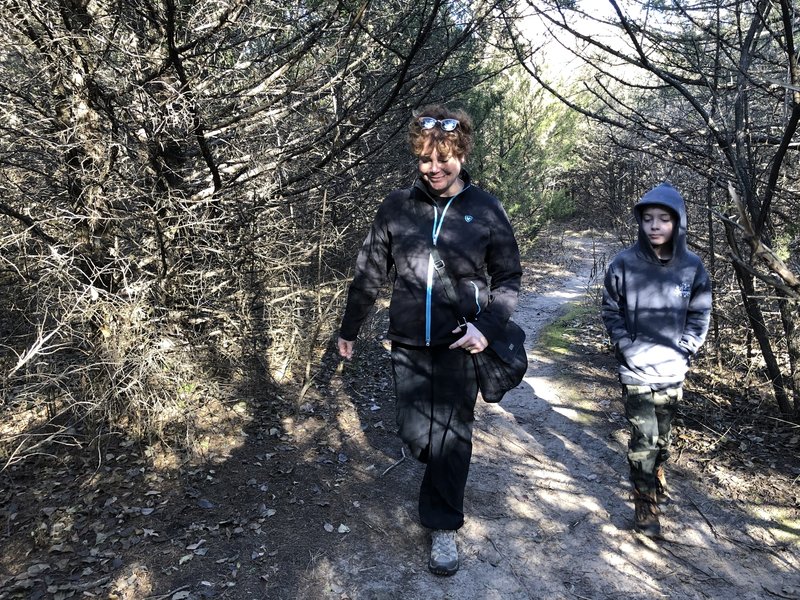 This area is a short connection through red cedar trees and beside the creek.