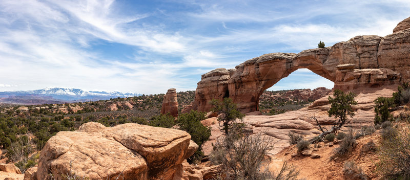 Broken Arch and snow covered La Sal Mountains.