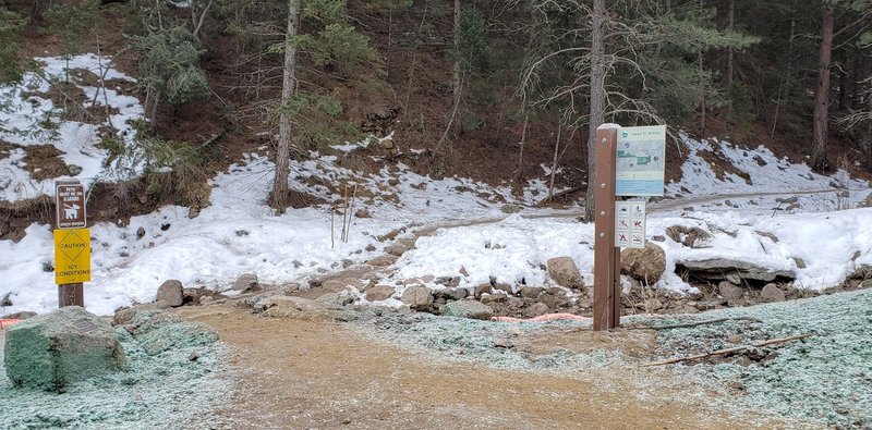 Trail starts at the west end of parking lot and immediately crosses the creek.