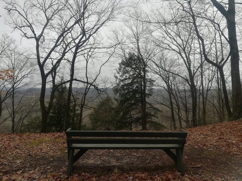 One of many views along this trail. A lone bench here is dedicated in honor of Val Nolan Jr. Photo taken during Winter. Coordinates:  [39.2607, -86.3245].