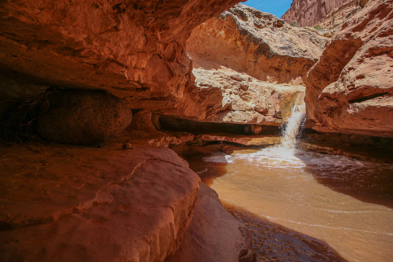 I find the boulder wedged in here adds to the interest.