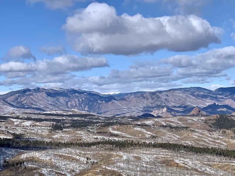 View looking NW from the summit of Signal Butte. Lost Creek Wilderness and a sliver of McCurdy Mountain (snow capped) in the distance.