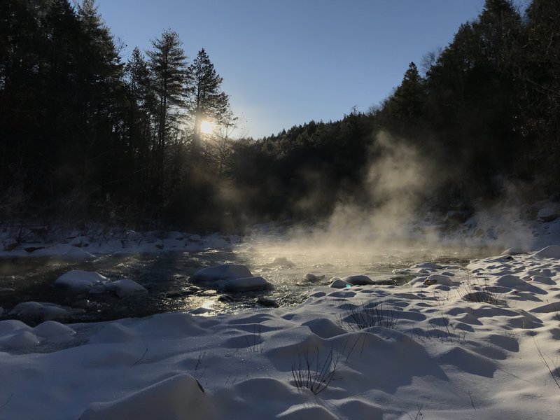 Misty river at sunrise.