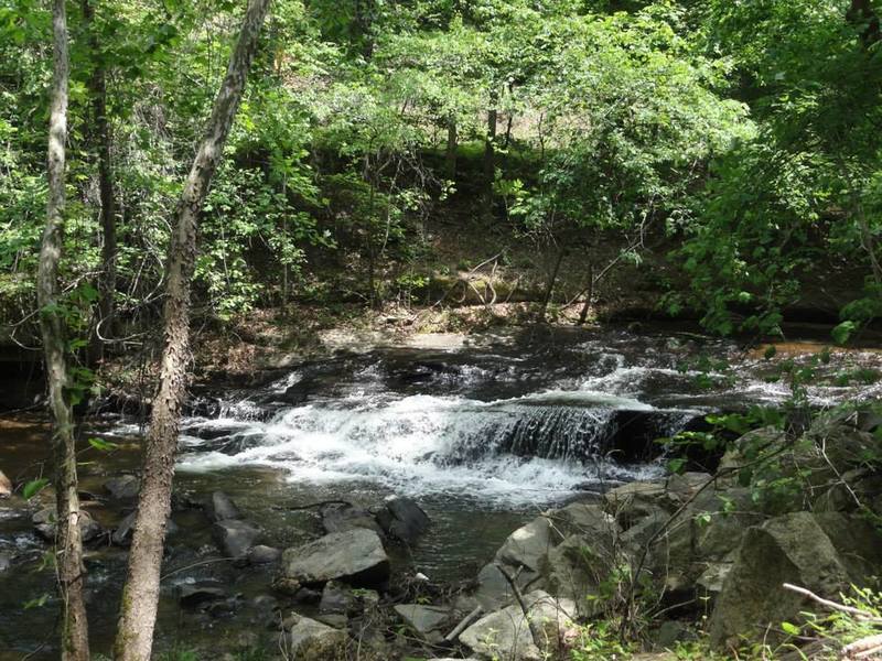 You'll see a small waterfall along the greenway as you hike.