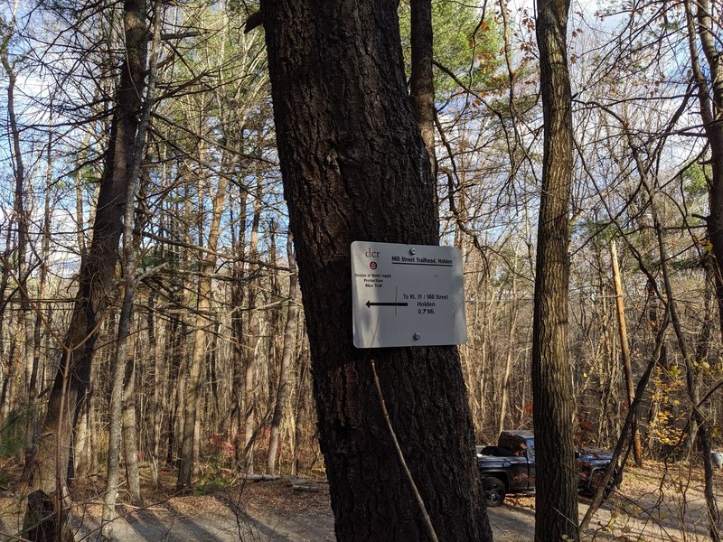 Difficult to find trail marker at the parking area on Mill Street.