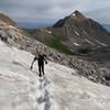 Crossing a snow field just past the saddle on the way to Capitol Peak.