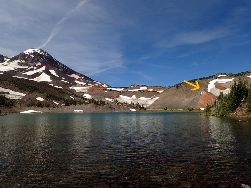 Where the trail (arrow) leaves Camp Lake; South Sister is on the right.