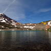 Where the trail (arrow) leaves Camp Lake; South Sister is on the right.