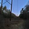 Looking up to where trail crosses Bay Road, and where this is room for 2 cars to park.