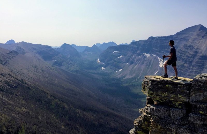 A hiker overlooking the Nyack Creek Valley near Dawson Pass.