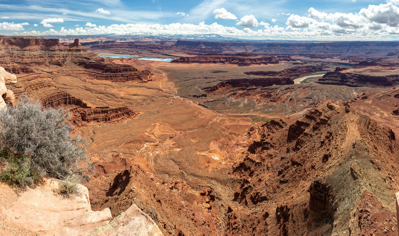 The most colorful rocks are almost 2,000 feet below as you stand on the edge of Dead Horse Point Overlook