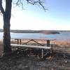 Picnic table by lake on orange trail about 1.5 miles from trailhead; great place to relax