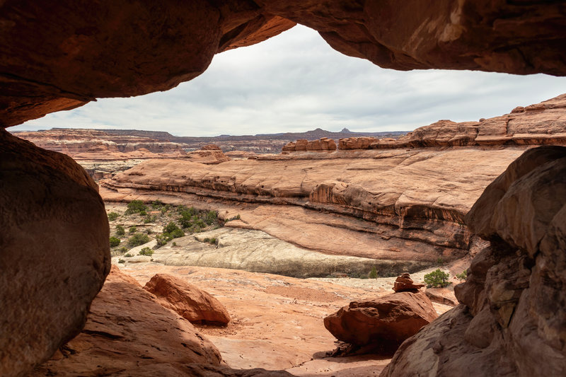 Crawl through this hole to continue on the Peekaboo Trail