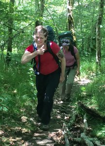 Hikers give a "thumbs up" for the work of volunteers improving the trail