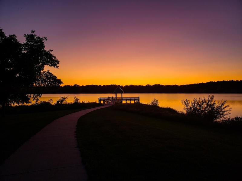 Chalco Hills Recreation Area, Omaha, NE - Fishing dock on cloudless sundown.