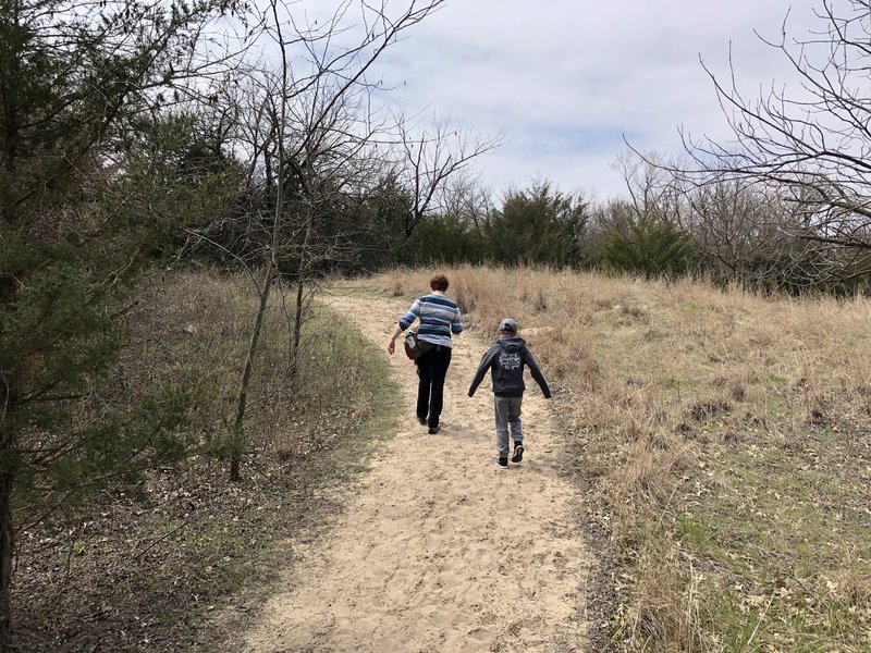 The entrance to the hike is pretty sandy over the first two hills (dunes?), but there is more dirt trails after that.