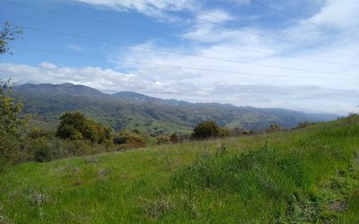 The Diablo Range is seen far into the distance, looking east-southeast from high on Heron Trail.