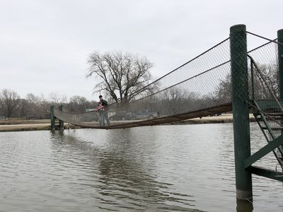Suspension bridge over the lake to connect the parking area to the Lakeside Trail