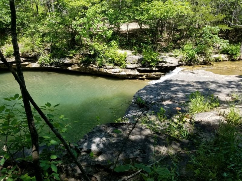 Swimming area with small waterfall.