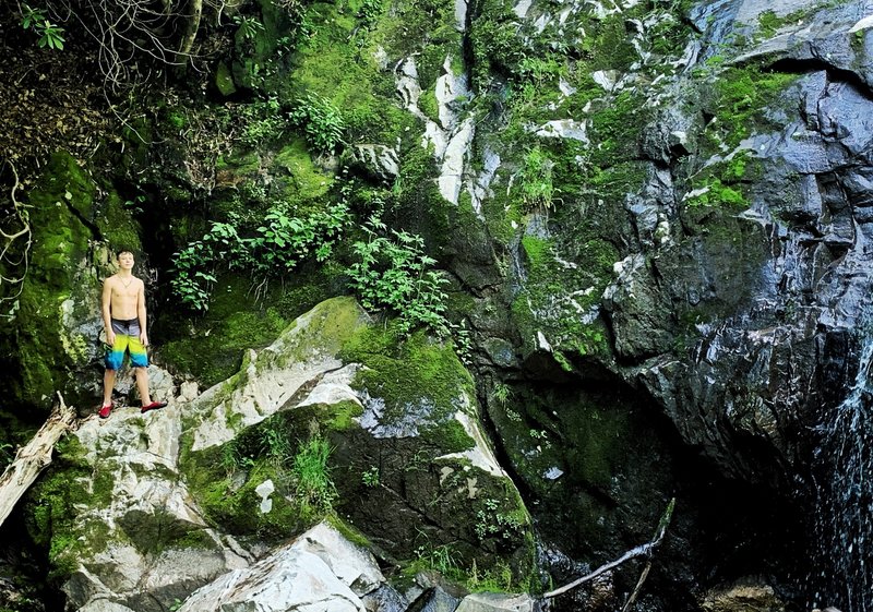 Climbing rocks at bottom of falls