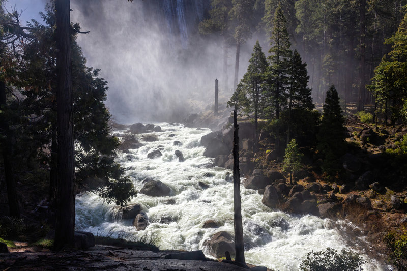 A roaring Merced River at the base of Nevada Falls