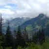 Looking behind from the meadow after the forest of the Marten Lake trail.