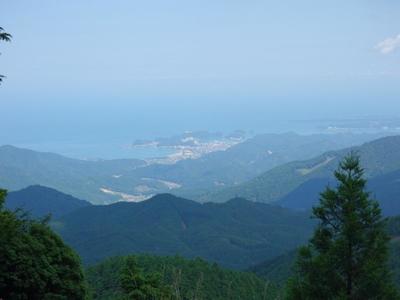 A hazy day view down to the sea.
