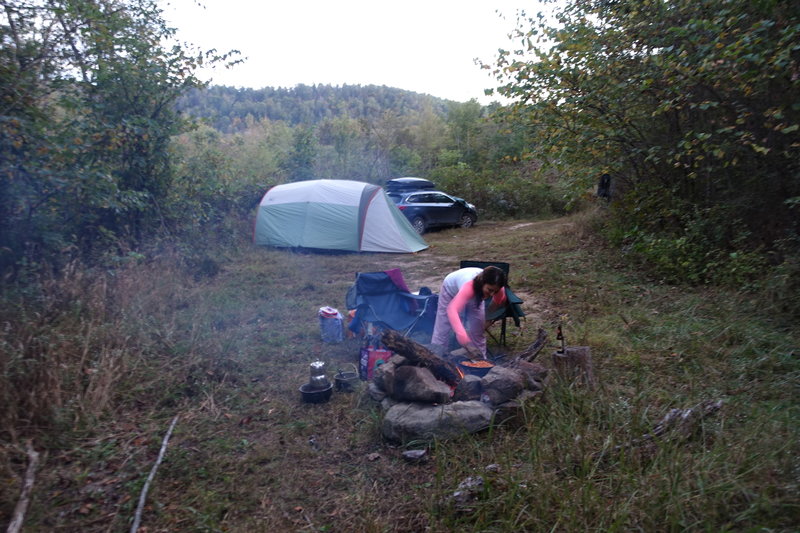 Parking area doubles as a campsite.